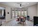 Eat-in kitchen area with a ceiling fan, window, and hardwood table at 6437 Boatbill St, North Las Vegas, NV 89084