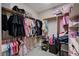 Well-organized walk-in closet with ample hanging space and shelving at 6437 Boatbill St, North Las Vegas, NV 89084