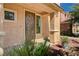 Close-up of a home's front entrance, showing the decorative door and tidy landscaping at 6437 Boatbill St, North Las Vegas, NV 89084