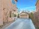 Long driveway leading to the detached garage with ample parking space and side yard at 6437 Boatbill St, North Las Vegas, NV 89084