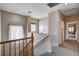 Upstairs hallway that offers a carpeted floor and access to multiple rooms at 6437 Boatbill St, North Las Vegas, NV 89084