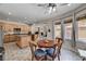 Kitchen and eat-in area featuring an island, wood cabinets, granite countertops, and stainless steel appliances at 6437 Boatbill St, North Las Vegas, NV 89084
