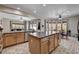 Open kitchen featuring an island, plenty of cabinets, and views of the living room and dining area at 6437 Boatbill St, North Las Vegas, NV 89084