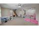 Spacious living room area with carpeted floors and ceiling fans, ideal for entertaining or relaxing at 6437 Boatbill St, North Las Vegas, NV 89084