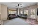 A well-lit living room showcases two couches and exterior access at 6437 Boatbill St, North Las Vegas, NV 89084