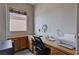 Office space featuring a built-in desk and storage, plus natural light at 6437 Boatbill St, North Las Vegas, NV 89084