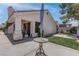 Landscaped backyard with healthy lawn and a stone feature at 6624 Old Oxford Ave, Las Vegas, NV 89108