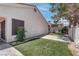 Manicured backyard with green grass, garden and tree views at 6624 Old Oxford Ave, Las Vegas, NV 89108