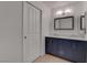 Bathroom featuring a double sink vanity with modern fixtures at 6624 Old Oxford Ave, Las Vegas, NV 89108