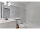 Bathroom featuring vanity, mirror, bathtub, shower, and toilet at 6624 Old Oxford Ave, Las Vegas, NV 89108