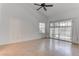 Well-lit bedroom with a ceiling fan and sliding glass doors to patio at 6624 Old Oxford Ave, Las Vegas, NV 89108