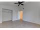 Bedroom showcasing tiled floors, and closet with a door leading to the house at 6624 Old Oxford Ave, Las Vegas, NV 89108