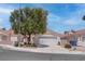 Charming single-story home with a well-manicured front yard and two car garage at 6624 Old Oxford Ave, Las Vegas, NV 89108
