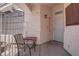 Cozy covered front porch with seating, creating a welcoming entrance to the home at 6624 Old Oxford Ave, Las Vegas, NV 89108