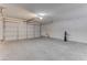 Spacious garage with a large door, concrete floor, and ample room for parking at 6624 Old Oxford Ave, Las Vegas, NV 89108