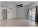 Open-concept living room features tile floors and a sliding glass door at 6624 Old Oxford Ave, Las Vegas, NV 89108