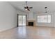 Bright living room featuring tile floors, a fireplace, and a sliding glass door leading to the backyard at 6624 Old Oxford Ave, Las Vegas, NV 89108