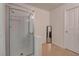 Tiled shower with glass door and tile flooring in the bathroom at 6624 Old Oxford Ave, Las Vegas, NV 89108