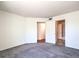 Spacious bedroom with neutral carpet, ample closet space, and a blank canvas for personal customization at 698 S Racetrack Rd # 1014, Henderson, NV 89015
