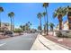 Welcoming community entrance with palm trees and well-maintained landscaping at 698 S Racetrack Rd # 1014, Henderson, NV 89015