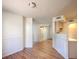Living area featuring hardwood floors and a pass-through to the kitchen at 698 S Racetrack Rd # 1014, Henderson, NV 89015
