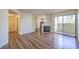 The living room showcases hardwood floors, fireplace, and access to a balcony at 698 S Racetrack Rd # 1014, Henderson, NV 89015