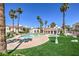 Resort-style pool with lush landscaping and palm trees at 698 S Racetrack Rd # 1014, Henderson, NV 89015