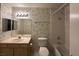 Traditional bathroom featuring a single vanity, tub, and patterned wallpaper design at 698 S Racetrack Rd # 1411, Henderson, NV 89015