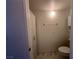 Half-bath with linoleum flooring, toilet, cabinet, shelves, and a towel rack at 698 S Racetrack Rd # 1411, Henderson, NV 89015