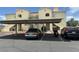 Apartment building with covered parking and some greenery at 698 S Racetrack Rd # 1411, Henderson, NV 89015