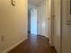 Neutral hallway featuring wood-look flooring leading to several rooms at 698 S Racetrack Rd # 1411, Henderson, NV 89015