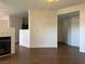 Open concept living area featuring tile flooring, modern fireplace and neutral paint palette at 698 S Racetrack Rd # 1411, Henderson, NV 89015