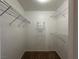 Walk-in closet with wire shelving, carpeted floors and a sign on the wall at 698 S Racetrack Rd # 1411, Henderson, NV 89015