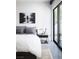 Modern bedroom with a sleek design, minimalist decor and walk out patio at 7030 Schirlls St, Las Vegas, NV 89118
