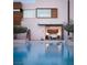 Modern home exterior featuring a pool with attached bedroom with glass doors at 7030 Schirlls St, Las Vegas, NV 89118