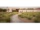 Landscaped front yard with a stone pathway leading to the entrance at 7030 Schirlls St, Las Vegas, NV 89118