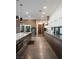 Modern kitchen with dual ovens, sleek cabinetry, and a large central island at 7030 Schirlls St, Las Vegas, NV 89118