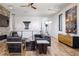 Bright, modern living room with stone fireplace, unique decor, and ample natural light at 7030 Schirlls St, Las Vegas, NV 89118
