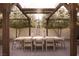 Elegant outdoor dining area under a wooden pergola, perfect for entertaining guests at 7030 Schirlls St, Las Vegas, NV 89118