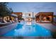 Stunning backyard pool with a modern cabana and sleek lounge chairs at 7030 Schirlls St, Las Vegas, NV 89118