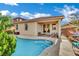 An inviting backyard features a private pool and covered patio, perfect for outdoor relaxation at 708 Kibbey St, Las Vegas, NV 89178