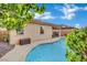 Capture the essence of outdoor relaxation in this home's backyard featuring a refreshing pool at 708 Kibbey St, Las Vegas, NV 89178