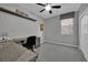 Bedroom with a desk, chair, ceiling fan, and organized shelving space at 708 Kibbey St, Las Vegas, NV 89178