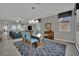 Open dining area with stylish lighting, table with seating for six, and plush area rug at 708 Kibbey St, Las Vegas, NV 89178