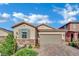 Charming single-story home with stone accents, desert landscaping, and a two-car garage at 708 Kibbey St, Las Vegas, NV 89178