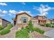 Charming single-story home with stone accents, desert landscaping, and a two-car garage at 708 Kibbey St, Las Vegas, NV 89178
