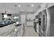 Open kitchen with a large island, stainless steel appliances, and a view of the dining area at 708 Kibbey St, Las Vegas, NV 89178