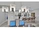 Kitchen featuring modern light fixtures, stainless steel appliances, and seamless access to dining area at 708 Kibbey St, Las Vegas, NV 89178