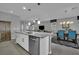 Modern kitchen with island and stainless appliances offering easy access to dining and living areas at 708 Kibbey St, Las Vegas, NV 89178