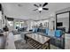 Spacious living room open to kitchen and dining area with modern decor and lots of natural light at 708 Kibbey St, Las Vegas, NV 89178
